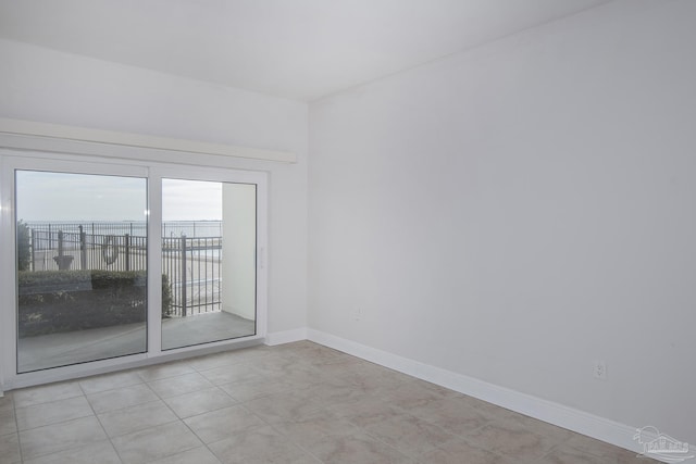 empty room featuring light tile patterned floors