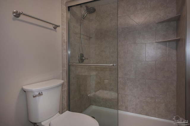 bathroom featuring toilet and an enclosed shower