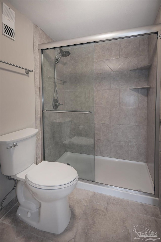 bathroom with toilet and walk in shower