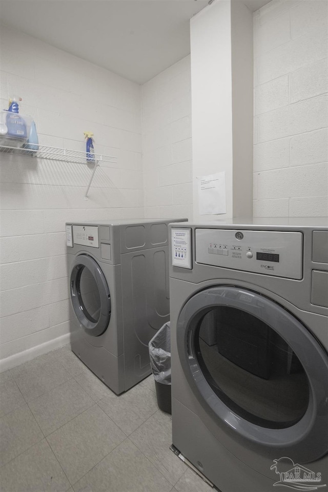 clothes washing area featuring separate washer and dryer