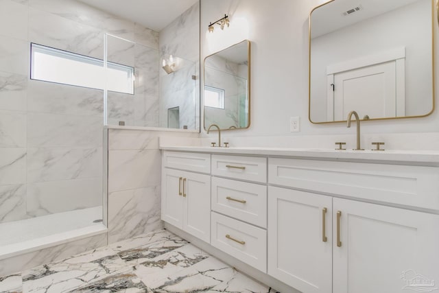 bathroom featuring vanity and tiled shower