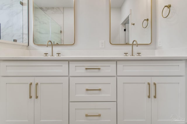 bathroom featuring vanity and an enclosed shower