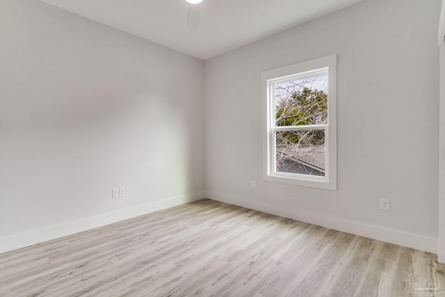 unfurnished room with ceiling fan and light wood-type flooring