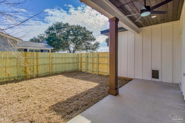 view of yard with a patio area and ceiling fan