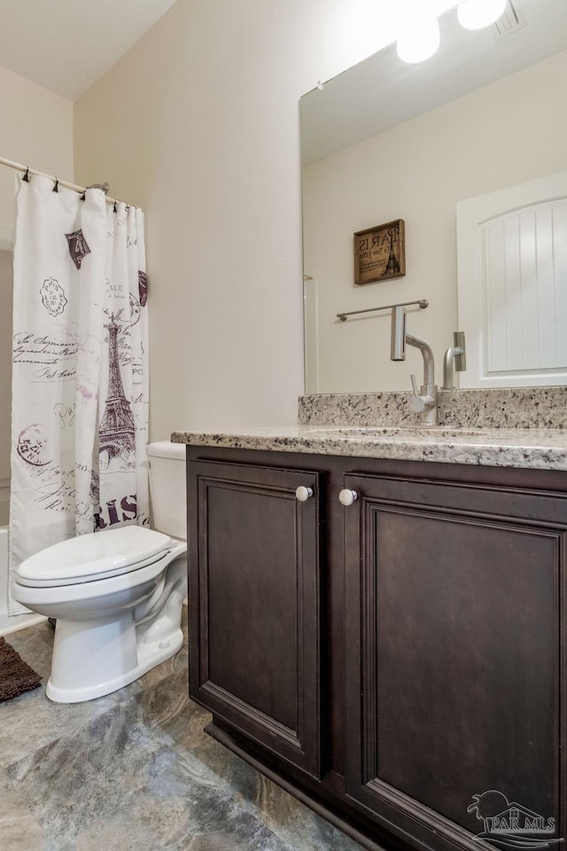 full bath with vanity, toilet, and shower / bath combo with shower curtain