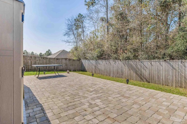 view of patio featuring a fenced backyard and outdoor dining area