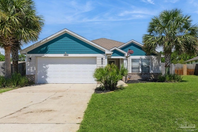 view of front of house featuring a front yard and a garage