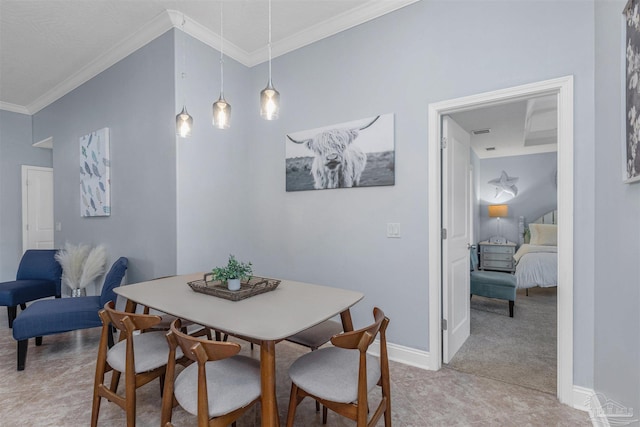 dining area featuring crown molding