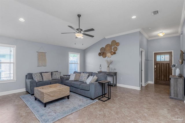 living room with ceiling fan, light tile patterned flooring, lofted ceiling, and ornamental molding