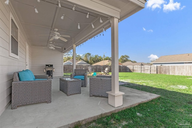 view of patio with an outdoor living space, area for grilling, and ceiling fan