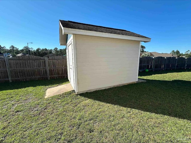 view of outbuilding featuring a yard