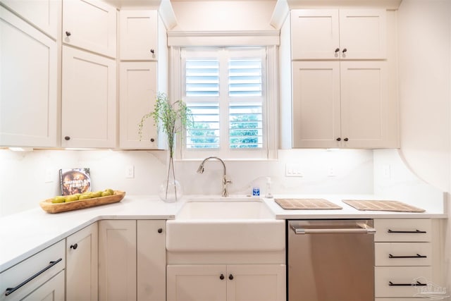 kitchen with white cabinetry, sink, and stainless steel dishwasher