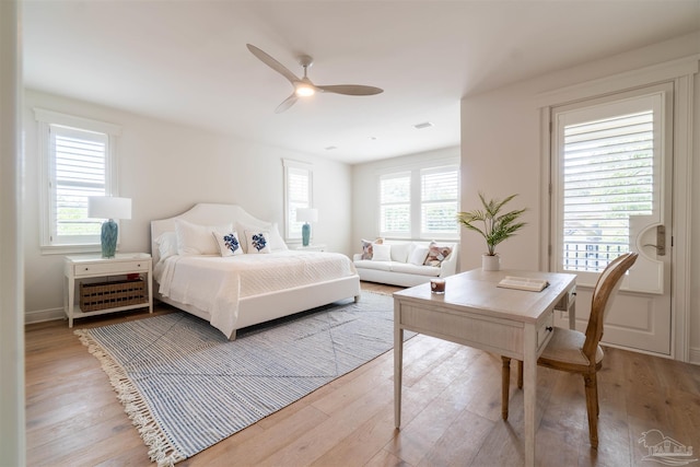 bedroom with hardwood / wood-style floors and ceiling fan