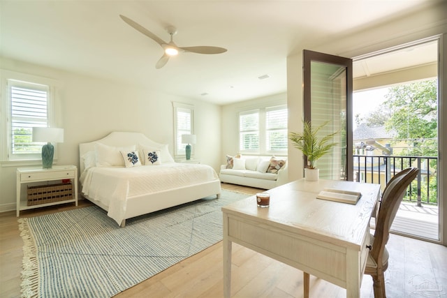 bedroom with hardwood / wood-style flooring, ceiling fan, and access to exterior