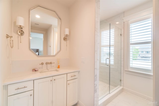 bathroom with vanity and an enclosed shower