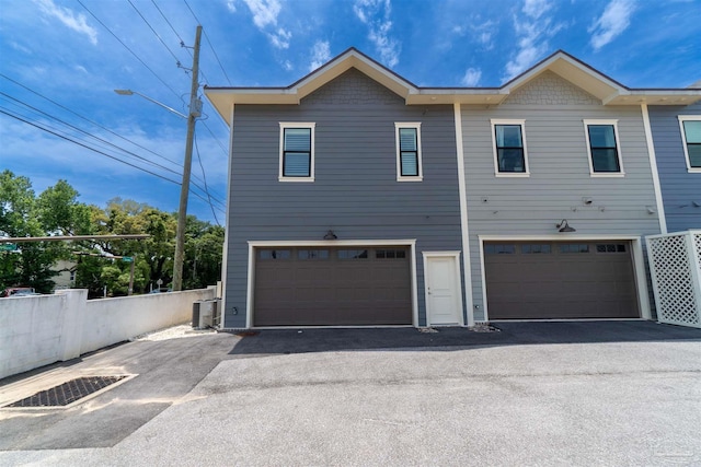 exterior space featuring a garage and central AC unit