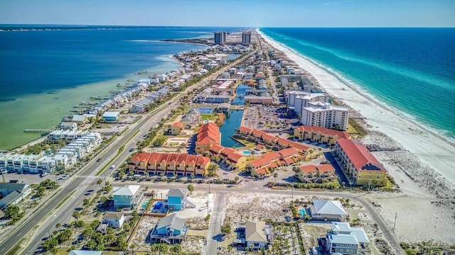 bird's eye view featuring a beach view and a water view