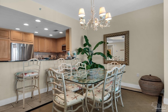 dining area with visible vents, baseboards, an inviting chandelier, tile patterned flooring, and recessed lighting