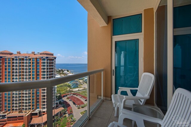 balcony featuring a water view