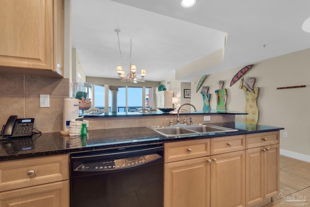 kitchen featuring light tile patterned floors, tasteful backsplash, dishwasher, light brown cabinetry, and a sink