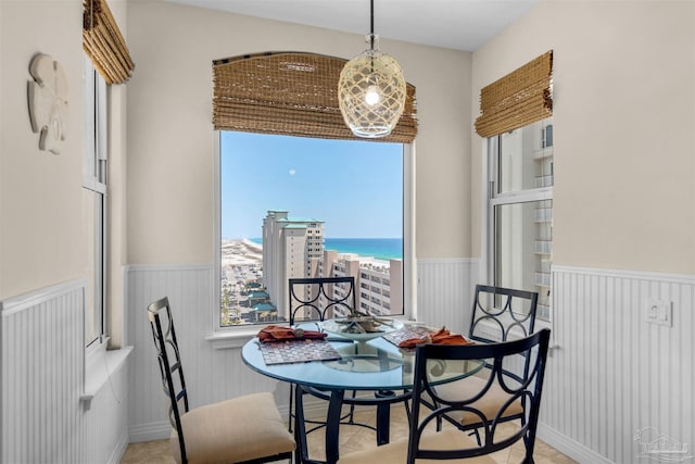 dining area featuring a water view