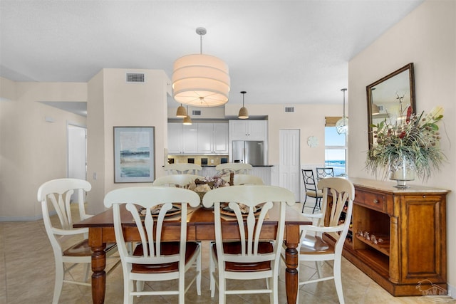 dining room featuring light tile patterned flooring