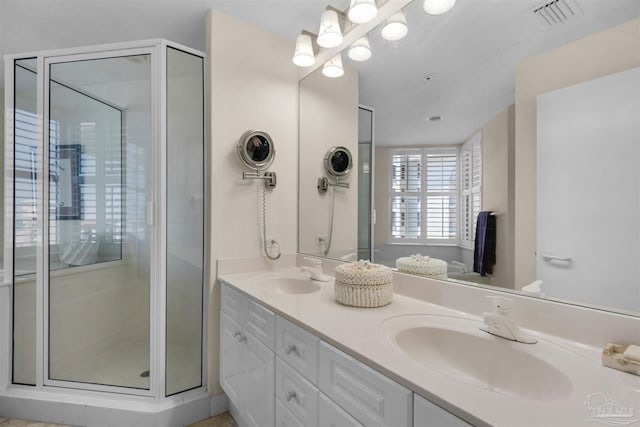 bathroom with vanity and walk in shower