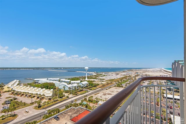 balcony with a beach view and a water view