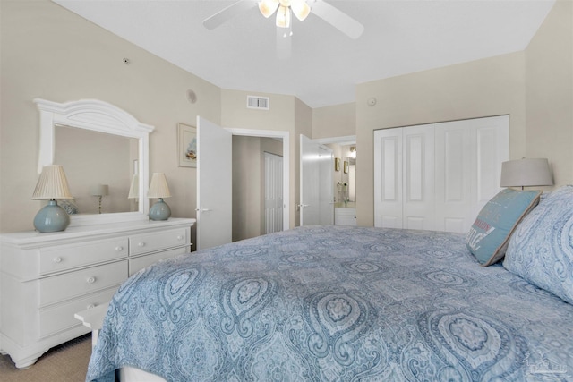 bedroom featuring connected bathroom, ceiling fan, and a closet