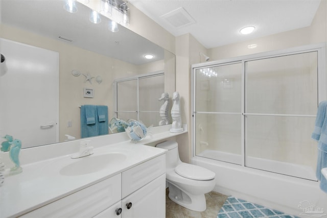 full bathroom with enclosed tub / shower combo, tile patterned floors, toilet, and vanity