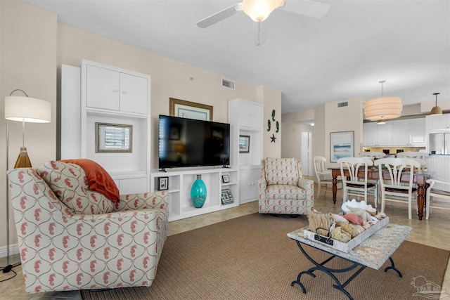 living room featuring ceiling fan