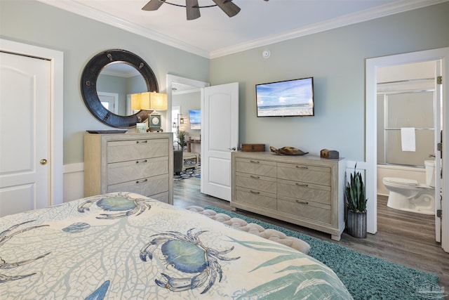 bedroom with ornamental molding, dark wood-type flooring, connected bathroom, and ceiling fan