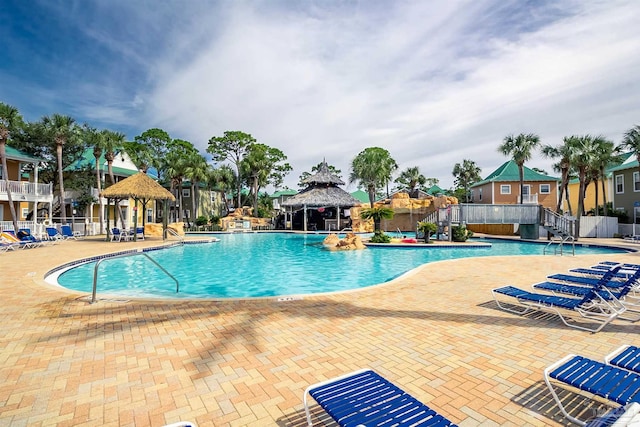 pool featuring a patio, a gazebo, and fence