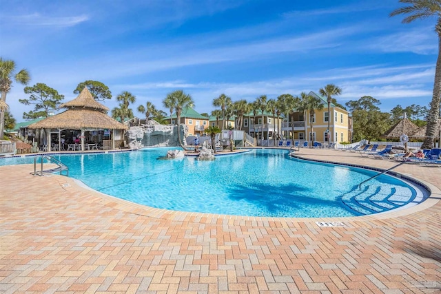 pool with a patio and a gazebo