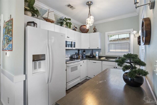 kitchen featuring white appliances, white cabinetry, visible vents, dark countertops, and crown molding