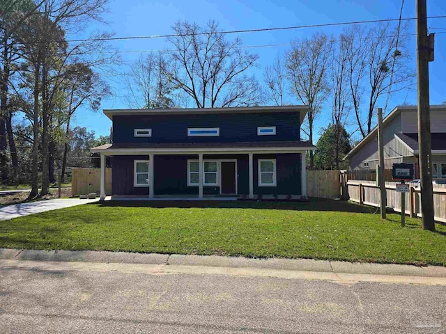 view of front of home with a porch, a front yard, and fence