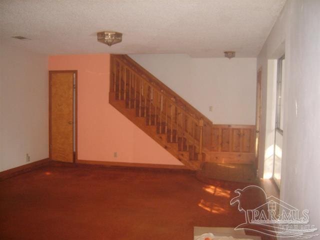 interior space featuring a textured ceiling