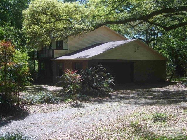 view of side of home featuring a garage