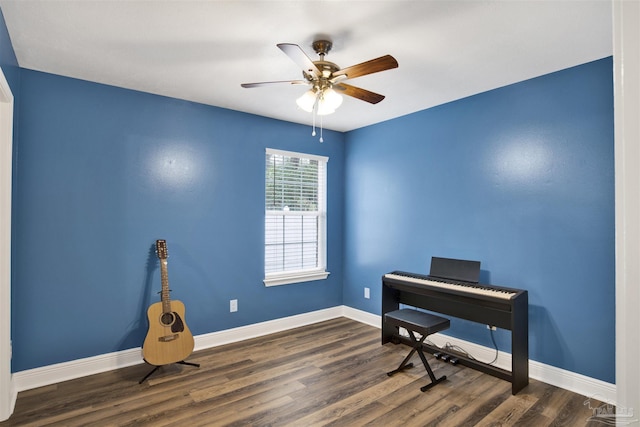 office with wood finished floors, a ceiling fan, and baseboards