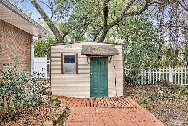 view of shed with fence