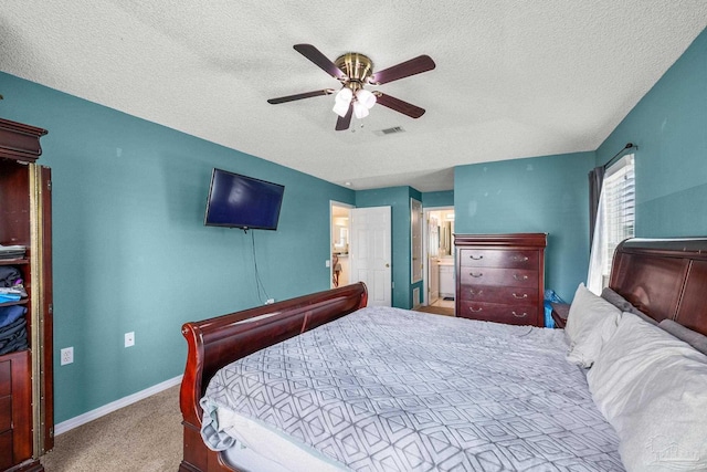 bedroom with baseboards, visible vents, light colored carpet, ceiling fan, and a textured ceiling