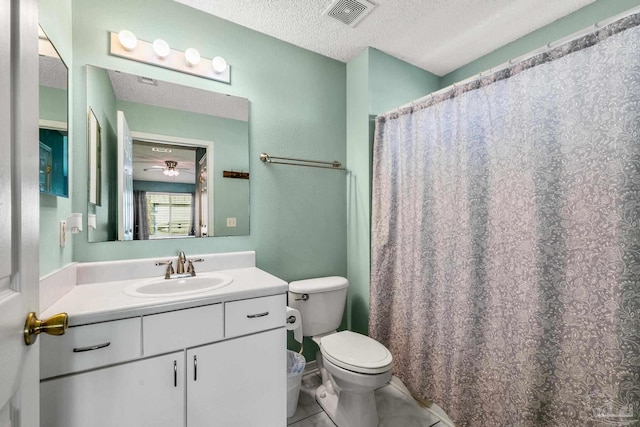 full bath featuring a textured ceiling, tile patterned flooring, toilet, vanity, and visible vents