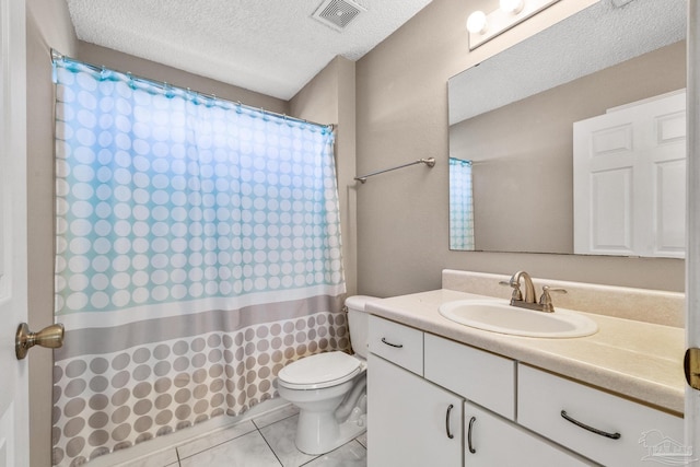 bathroom with a textured ceiling, tile patterned flooring, toilet, vanity, and visible vents