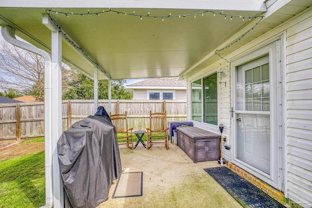 view of patio / terrace with fence and grilling area