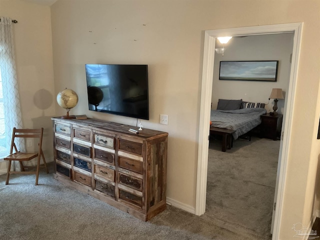 bedroom featuring carpet flooring and baseboards