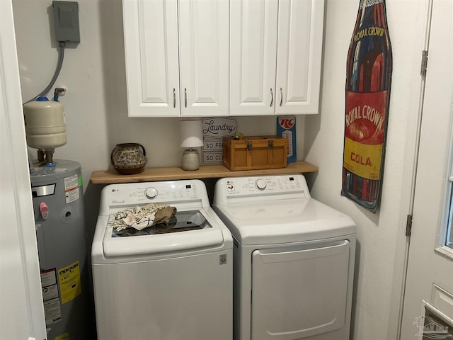 laundry room with water heater, cabinet space, and washer and dryer