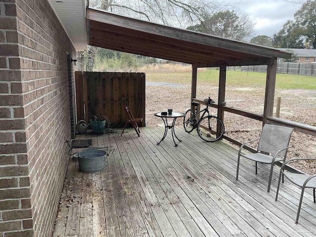 dock area featuring fence and a wooden deck