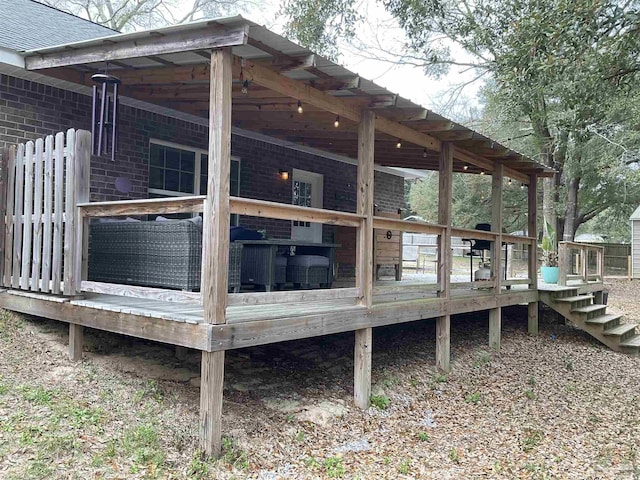 wooden deck with a carport