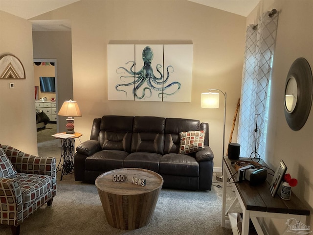 carpeted living room with vaulted ceiling