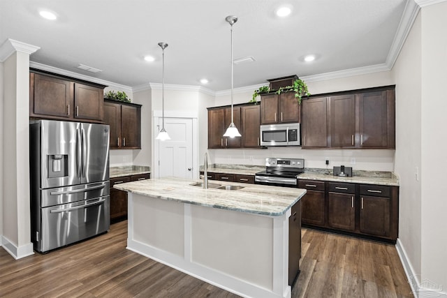 kitchen with appliances with stainless steel finishes, a sink, dark brown cabinets, and ornamental molding